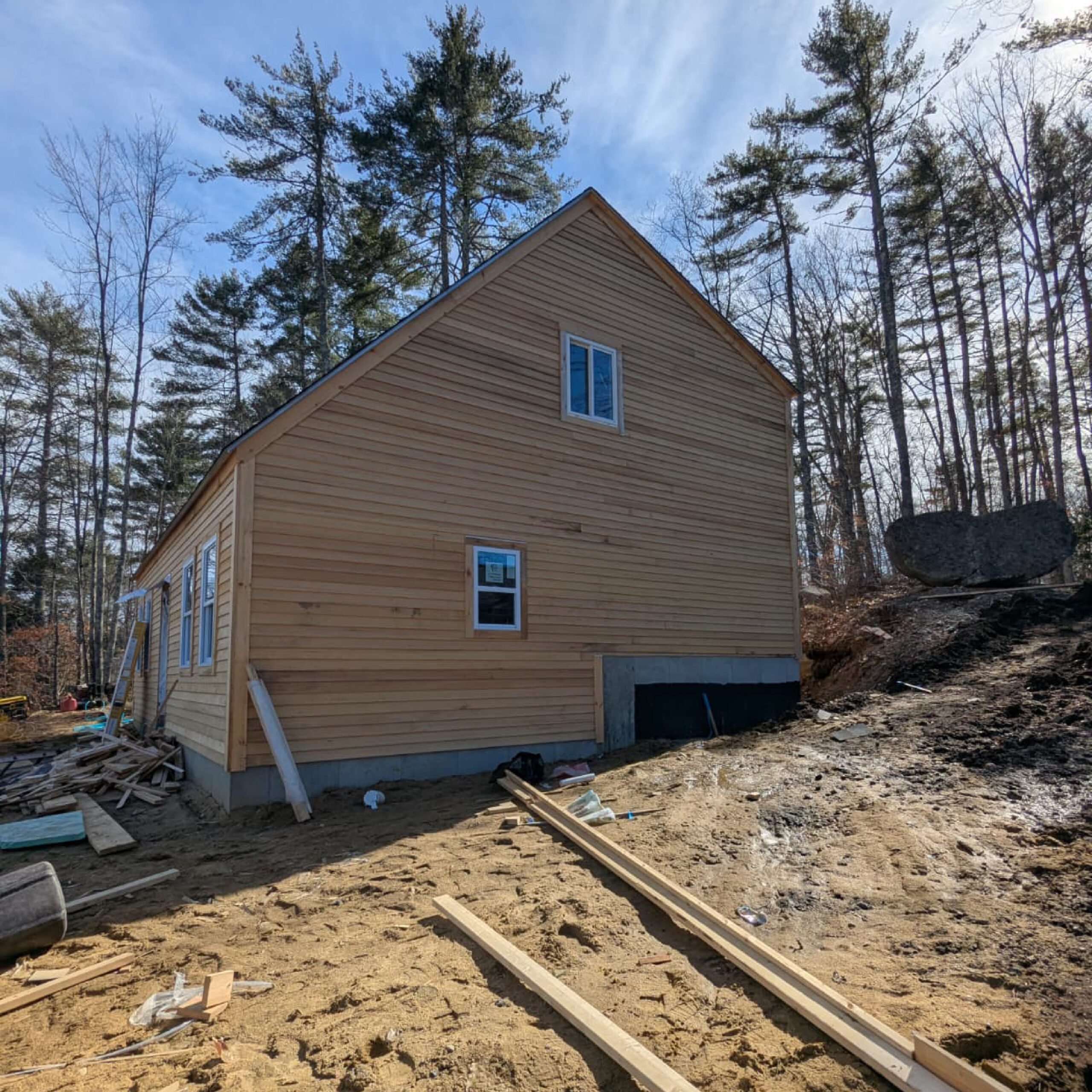 Rear exterior of a modern residential home project by Family Realty Holdings