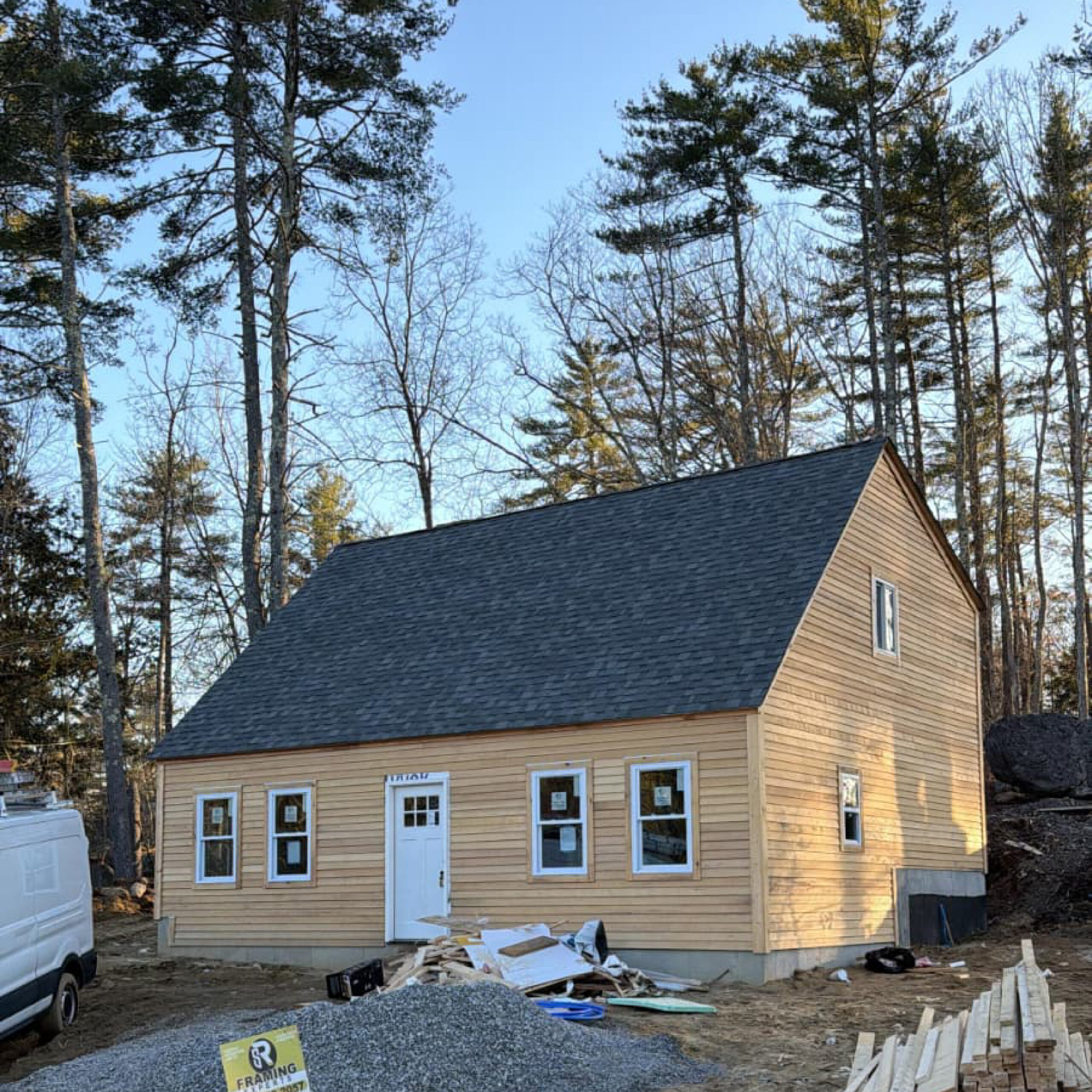 Exterior of a newly built cottage-style home by Family Realty Holdings