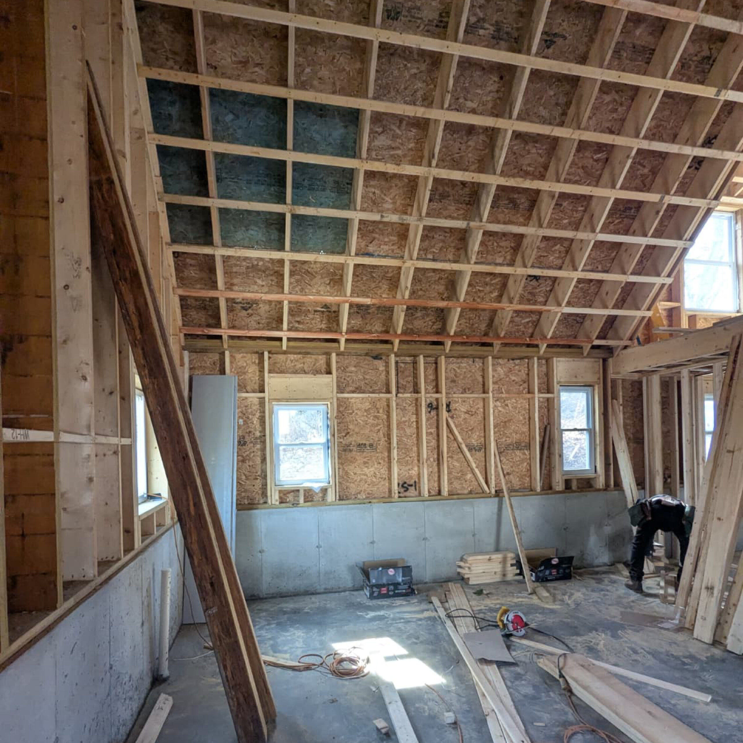 Interior framing structure of a custom-built home by Family Realty Holdings