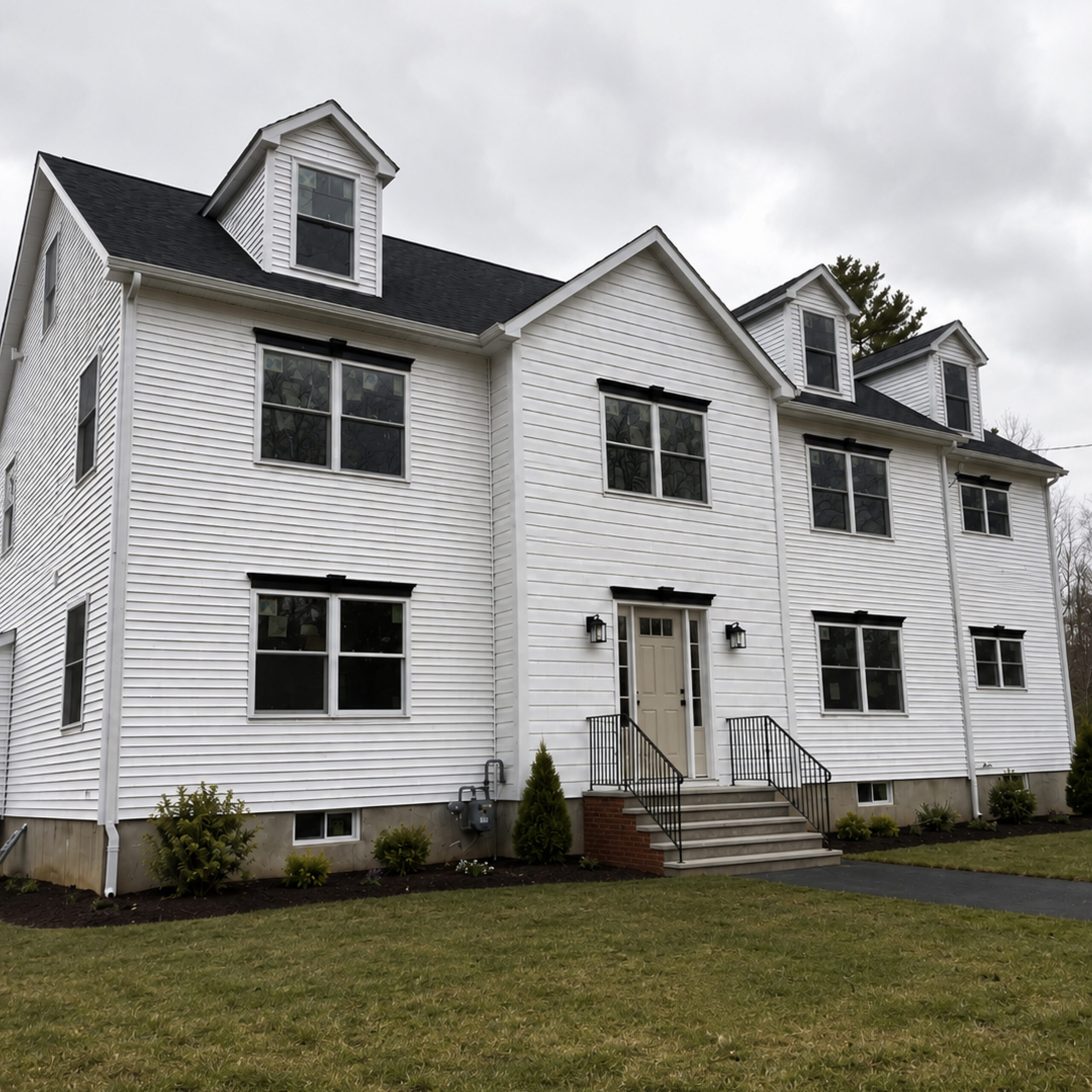 Family Realty Holdings Westford House exterior featuring completed multi-family residential development with modern farmhouse architecture