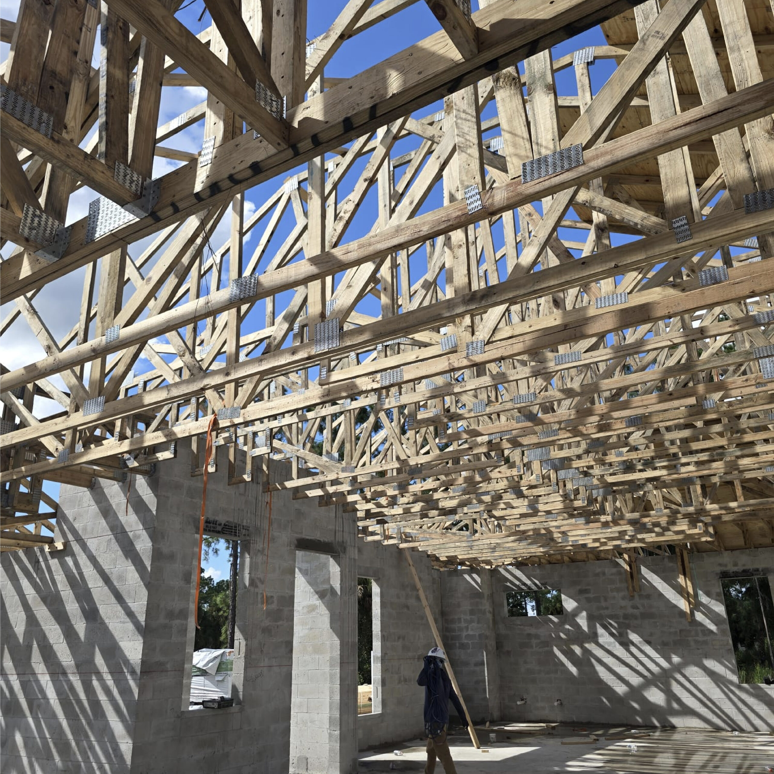 Family Realty Holdings Plumosa House structural framing phase showing residential construction progress and craftsmanship